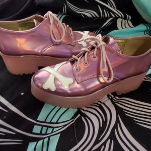 Holographic pink crossbone platforms